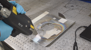 Handheld laser removing PVD coating